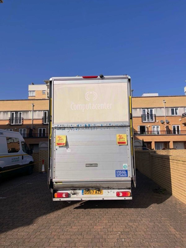 Rear view of Luton van with hydraulic tail lift